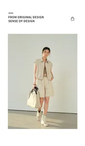 Stylish beige linen wide-leg shorts and matching vest outfit worn by Asian model