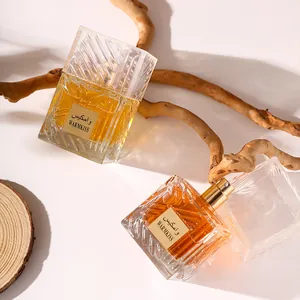 Elegant neutral Arabic perfume in faceted glass bottles with warm golden fragrance