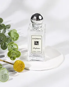 Detail view of Dignife perfume bottle with elegant silver cap and minimalist label