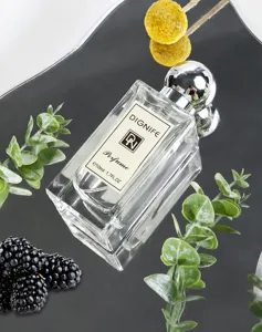 Detail view of Dignife fruity floral perfume bottle with blackberries and leaves