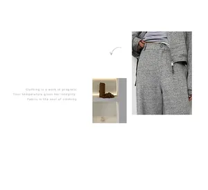 Detailed view of grey textured casual sweatshirt and pants set waist area