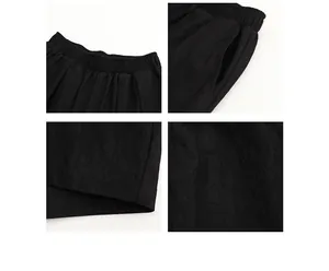 Detailed views of black wide-leg casual pants showing waistband, pockets, and fabric texture.