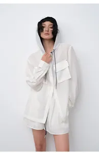 Close-up of white tencel ramie hooded shirt and shorts set on Asian model