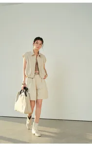 Linen high-waisted wide-leg shorts with belt styled in a minimal outfit.