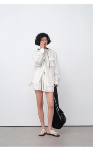 Model wearing white breathable Tencel ramie casual elastic waist shorts with mesh bag