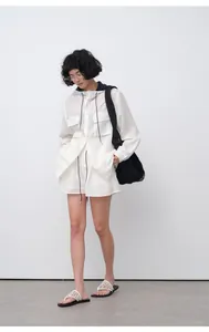 Model wearing white breathable Tencel ramie casual shorts in a minimalist studio setting