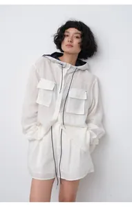 Female model wearing breathable white tencel ramie hooded shirt and shorts set
