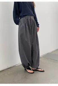Close-up of vintage plaid gathered-hem casual trousers for women in a loose fit