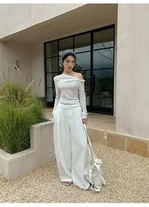 Full view of women's white retro wide-leg casual trousers with matching knit top