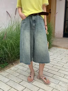 Vintage φαρδύ τζιν παντελόνι culotte με ξεφτισμένο στρίφωμα και παλαιωμένη εμφάνιση.