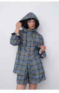 Asian model wearing blue and olive plaid tencel ramie hooded shirt and shorts set