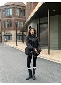 Asian woman wearing black shark skin leggings for yoga in an urban street setting