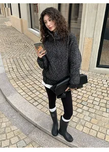 Close-up of thermal black shark skin yoga leggings worn by a model in lifestyle setting.