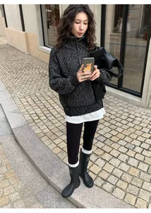 Stylish Asian model in urban setting wearing black skin-friendly warm yoga leggings