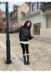 Asian model wearing black thermal yoga shark leggings on a European style street detail