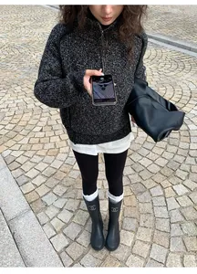 Black high-waisted thermal shark skin leggings for women in outdoor street setting