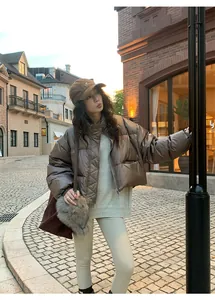 Outdoor street style shot of women's beige thermal yoga leggings for winter wear