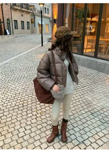 Model wearing beige warm shark skin yoga leggings in a winter street style look