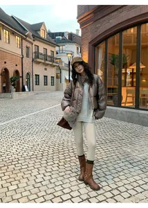 Asian model wearing beige thermal yoga leggings in a stylish outdoor street setting
