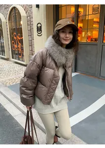 Woman wearing cream thermal yoga leggings in an urban outdoor autumn street setting.
