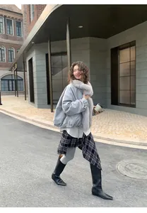 Grey warm shark yoga leggings for women styled with boots in a winter street look