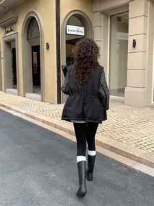 Women's thermal shark yoga leggings worn by a model walking on a European street.