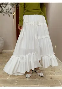 White tiered bohemian maxi skirt with asymmetric hem and ruffle details for summer