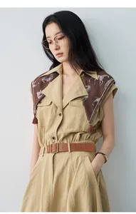 Detail view of khaki sleeveless A-line dress with horse pattern scarf and belt