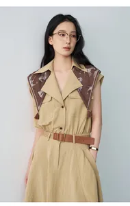 Waist-cinched sleeveless A-line dress with patterned scarf collar detail