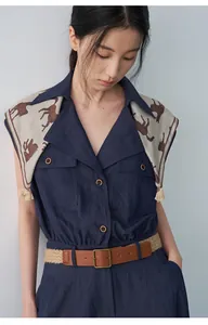 Elegant navy sleeveless dress detail featuring a lapel collar and horse print scarf