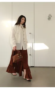 Elegant brown tiered ruffle maxi skirt with irregular hem and elastic waist design