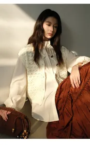 Detail of irregular long brown tiered cake skirt with rich pleated texture