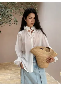 Elegant white floral collar blouse styled with light blue straight denim midi skirt