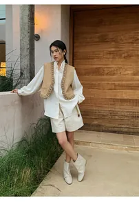 Outdoor full-body view of women's linen wide-leg shorts with a belted waist