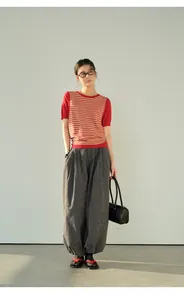 Full-length view of women's vintage grey plaid cuffed loose harem pants for casual style
