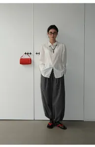 Full-length view of vintage checkered loose harem pants for a casual chic style.