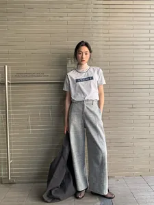 Elegant grey casual outfit featuring a short sleeve tee and wide leg trousers for women