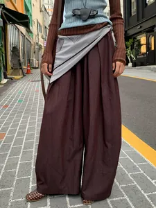 Women's brown wide-leg casual pants with stylish scarf waist detail in street style
