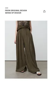 Detailed view of women's olive green tencel linen wide-leg trousers in a loose fit