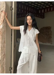 White Lyocell Tencel casual wide-leg pants and embroidered shirt on an Asian model