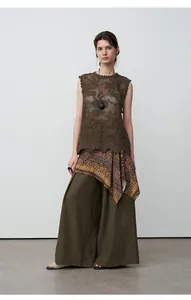 Relaxed-fit tencel linen wide-leg pants in earthy tones with a bohemian draped waist detail.