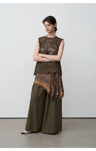 Detail view of olive green tencel linen wide-leg trousers with elegant drape for women