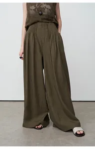 Elegant high-waisted olive green wide-leg trousers in tencel linen with pleated detail