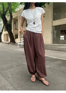 Outdoor street style view of woman wearing brown Lyocell Tencel casual lantern wide-leg pants