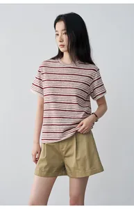 Khaki pleated casual shorts with rolled hems worn by a woman for a summer look