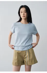 Asian model in light blue t-shirt and khaki pleated mid-waist cuffed casual shorts