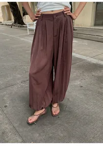 Close-up of brown Lyocell Tencel lantern wide-leg pants for a relaxed summer street look.