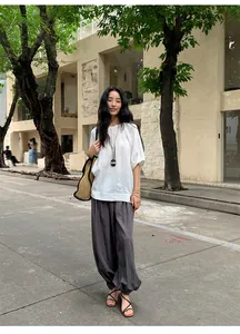 Full-body street view of woman wearing Lyocell Tencel lantern wide-leg casual trousers