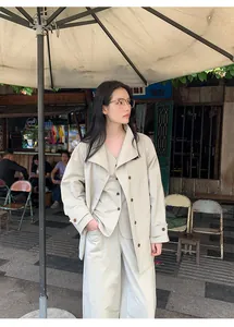 Minimalist beige high-waist wide-leg pants and matching set for an elegant outdoor look.