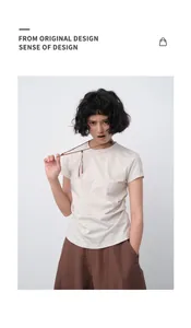 Close-up of minimalist beige slim-fit T-shirt on a model for a modern summer look